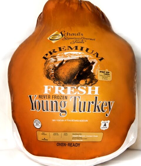 A turkey is sitting in the middle of a bag.