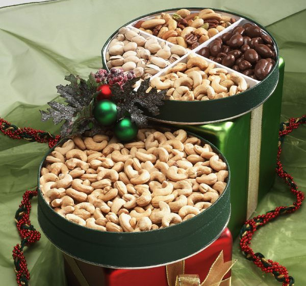 Two tins of nuts are sitting on a table.
